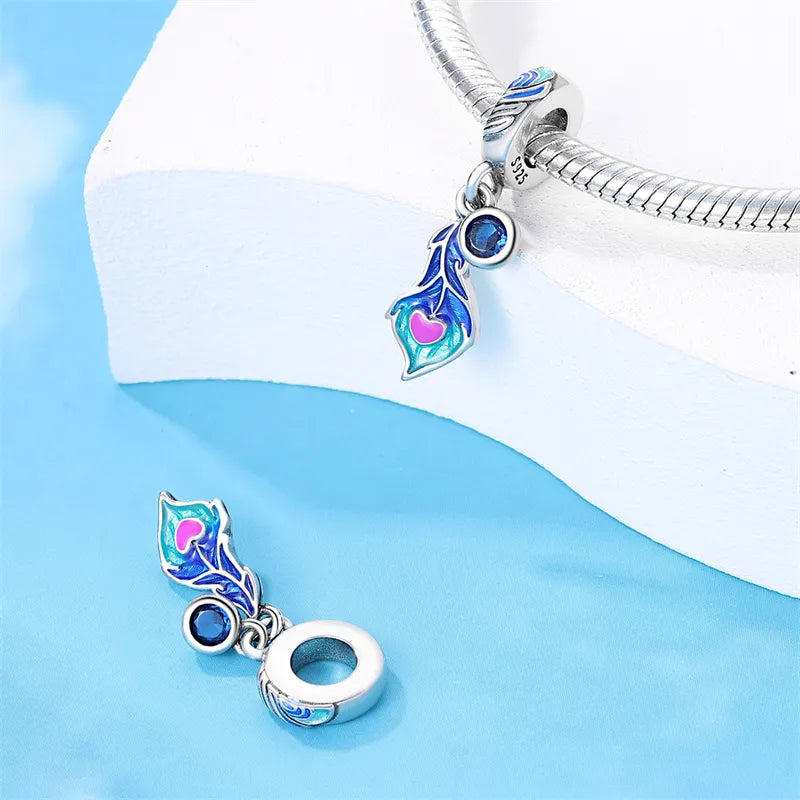 Charm pendentif plume de paon et cristal bleu en argent - Korell charms