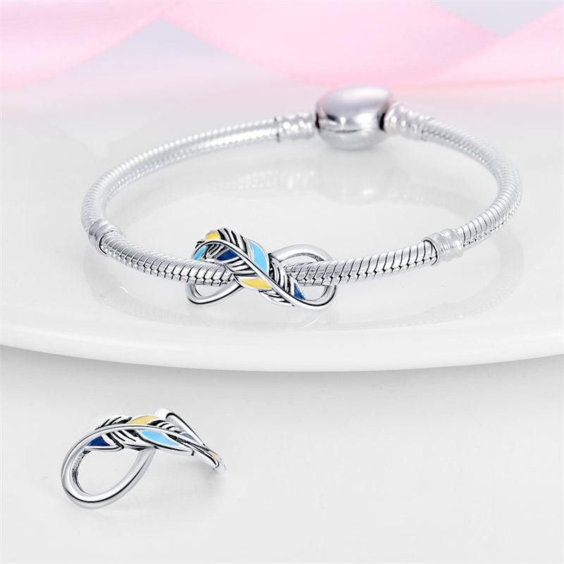 Charm infini plume bleue et jaune en argent - Korell charms