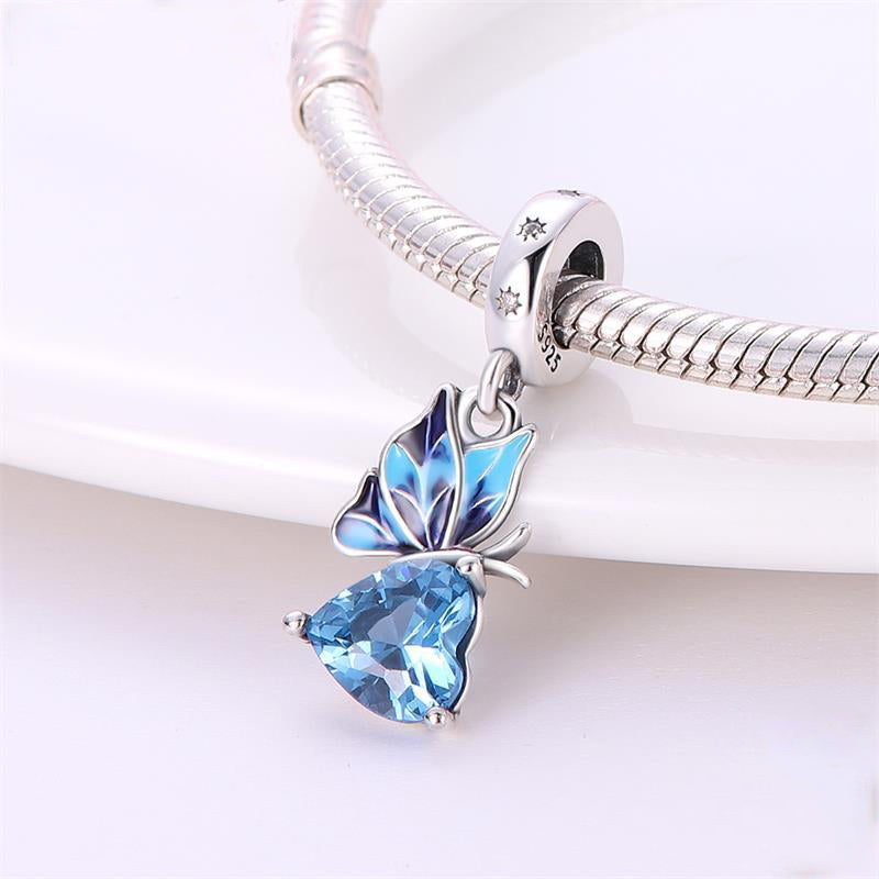 Charm pendentif papillon bleu sur cœur en cristal bleu en argent - Korell charms