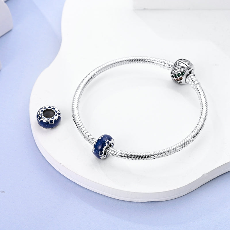 Charm perle bleu foncé à étoiles en argent - Korell charms